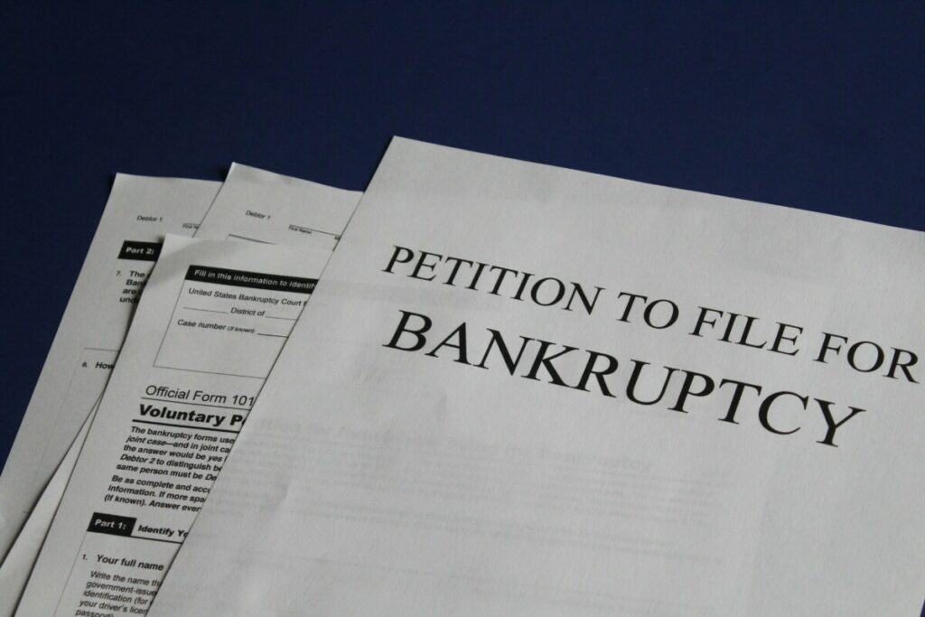 how much debt do you need to file bankruptcy