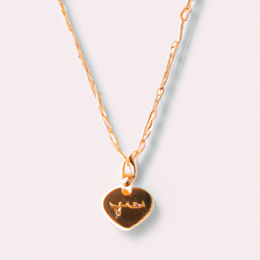 An image showcasing a delicate gold necklace with a heart-shaped pendant, intricately engraved with the couple's initials