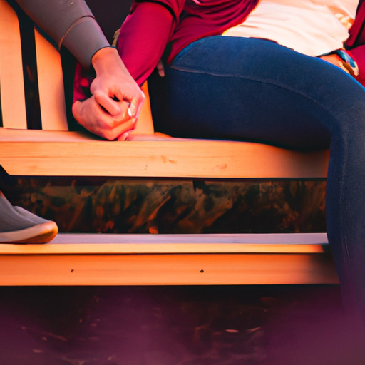 An image showcasing a young couple, hands intertwined, sitting on a park bench under a vibrant sunset