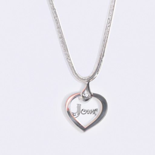 An image of a delicate silver necklace with a heart-shaped pendant, engraved with both your initials