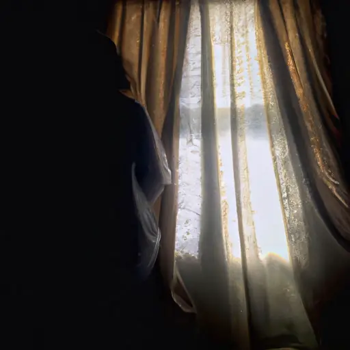 An image of a solitary figure, their silhouette cast against a dimly lit room, as rays of sunlight filter through a window adorned with delicate white curtains, symbolizing the weight of grief and the longing for light amidst loss