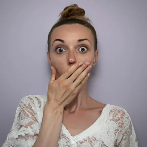 An image featuring a person with a surprised expression, eyes wide open, one hand covering their mouth, and the other hand slightly raised, as if shocked or hiding a secret