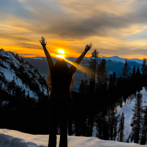 An image of a person standing confidently on a mountaintop, arms outstretched, surrounded by a vibrant sunset